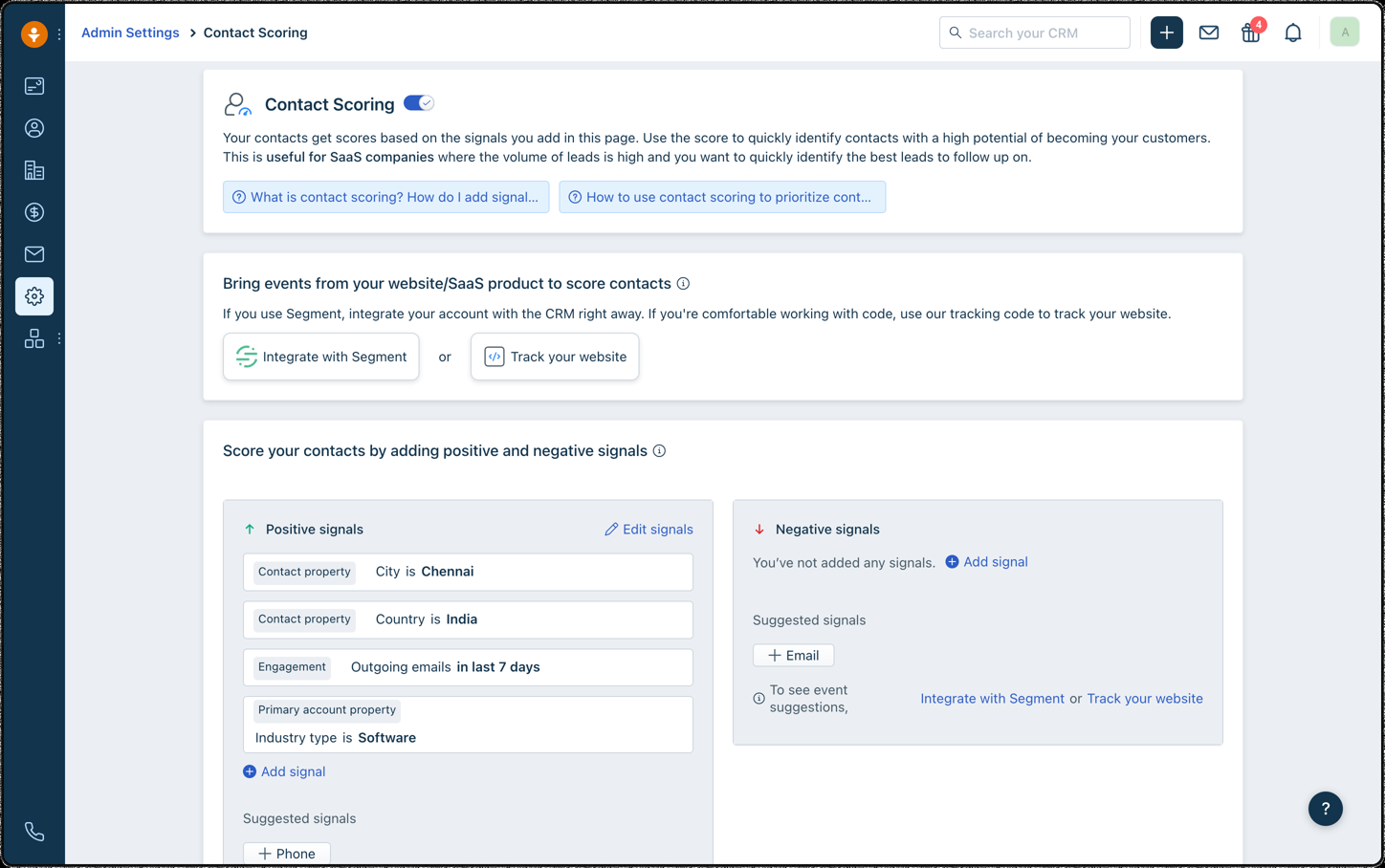 Freshsales Admin Settings contact scoring page with positive and negative signal lists and Segment and website tracking options